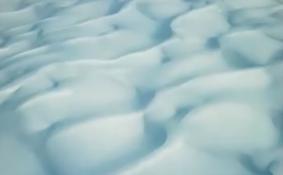 沙漠变“雪海”  库木塔格沙漠迎40年不遇大雪